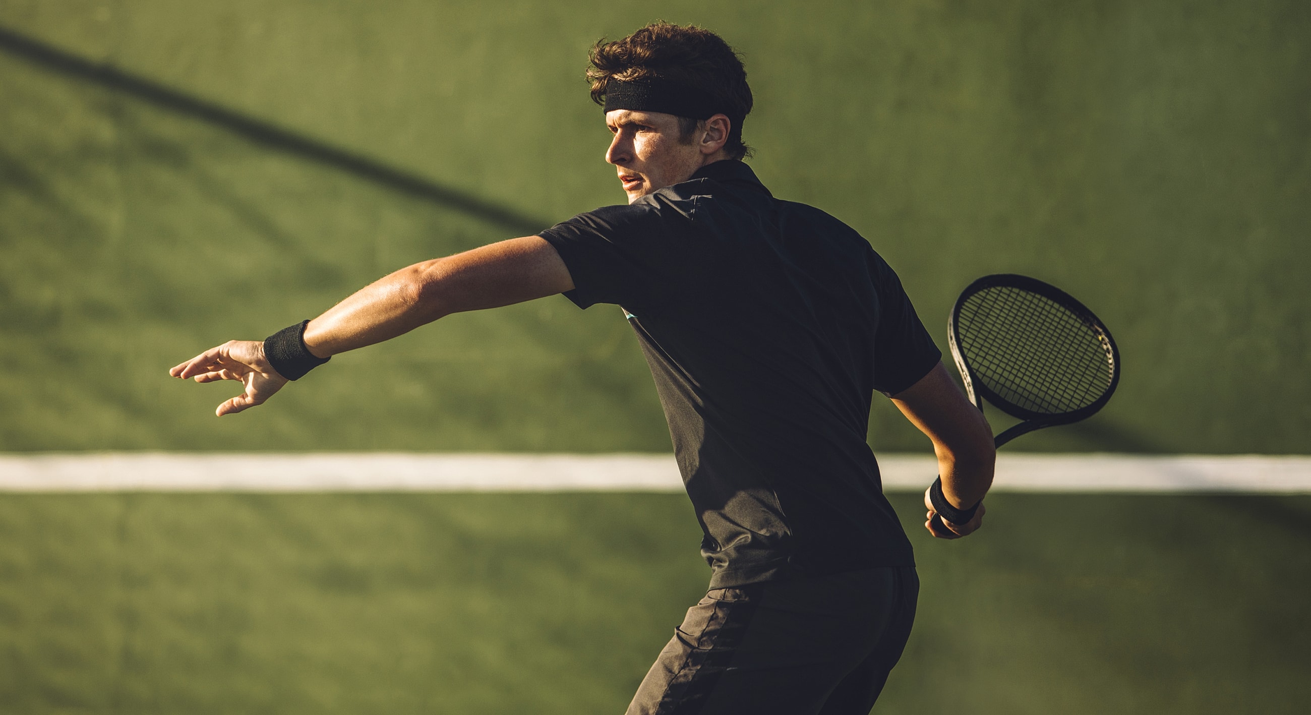 Tennis player preparing to hit a ball.