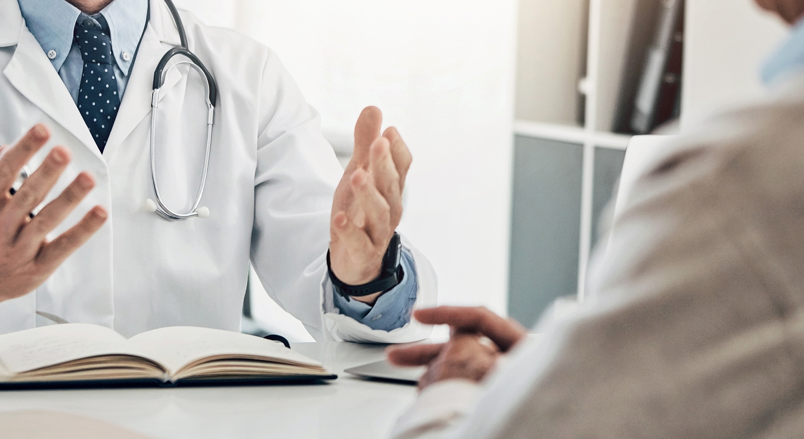 Doctor discussing medical information with a patient.